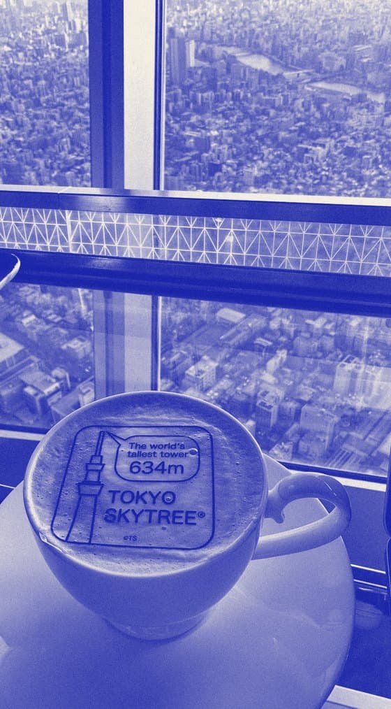 A latte with Tokyo Skytree foam art, high above the city, 2024